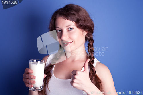 Image of woman enjoying a glass of milk 