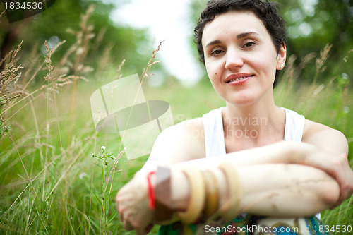 Image of cute girl on green field 