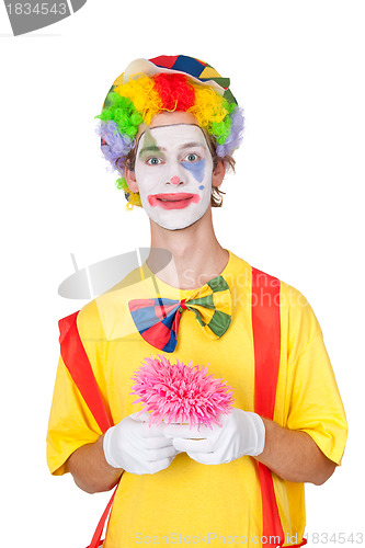 Image of Clown holding pink flower