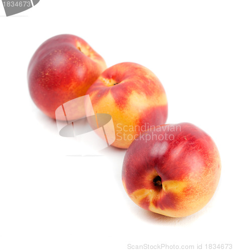 Image of Three ripe nectarines