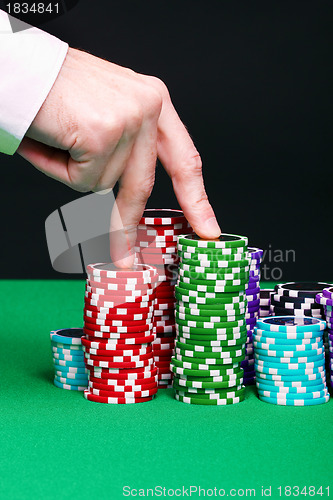 Image of hand "walking" on the gaming pieces