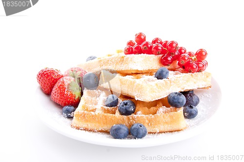 Image of sweet fresh tasty waffles with mixed fruits isolated