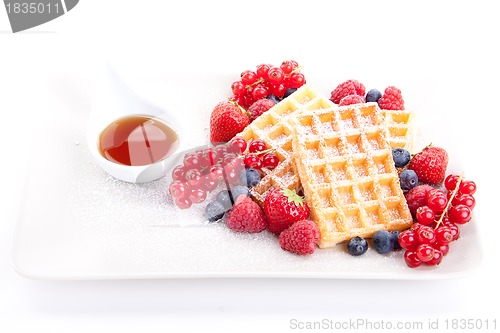 Image of sweet fresh tasty waffles with mixed fruits isolated