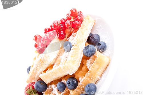 Image of sweet fresh tasty waffles with mixed fruits isolated