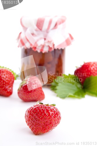 Image of deliscious strawberry jam with fresh fruits isolated