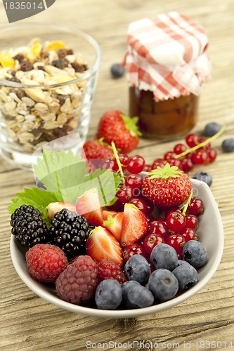 Image of fresh tasty berry collection on table in summer