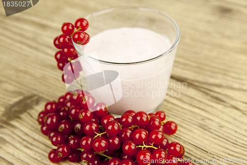 Image of deliscious fresh currant yoghurt shake dessert on table