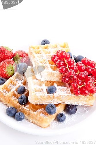 Image of sweet fresh tasty waffles with mixed fruits isolated