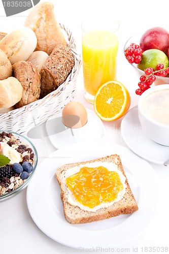 Image of breakfast table with toast and orange marmelade isolated