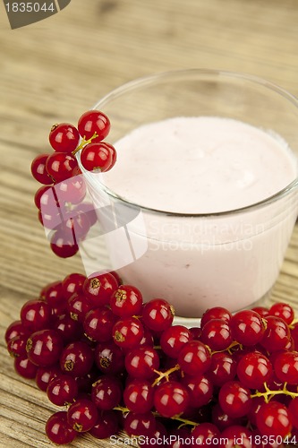 Image of deliscious fresh currant yoghurt shake dessert on table