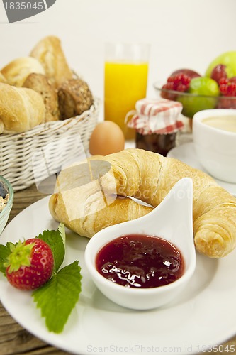 Image of traditional french breakfast on table in morning