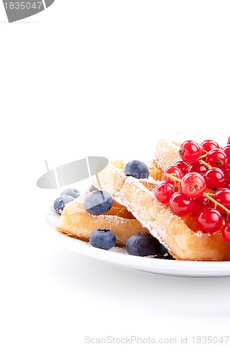 Image of sweet fresh tasty waffles with mixed fruits isolated