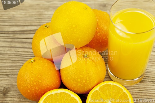 Image of fresh and  healthy tasty orange juice on table
