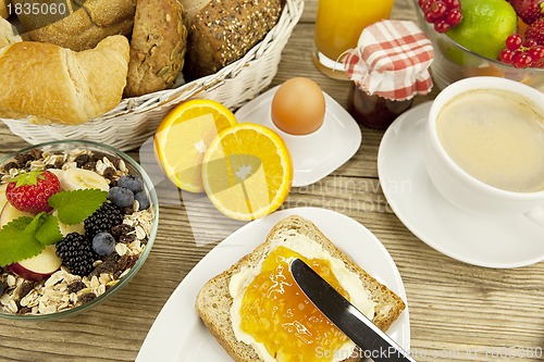 Image of tasty breackfast with toast and marmelade on table