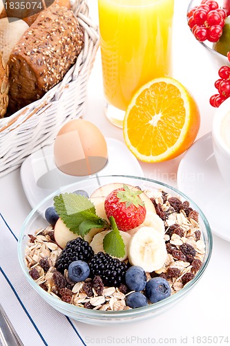 Image of deliscious healthy breakfast with flakes and fruits isolated