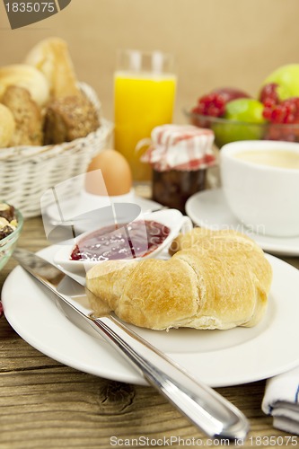 Image of traditional french breakfast on table in morning