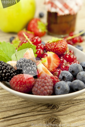 Image of fresh tasty berry collection on table in summer