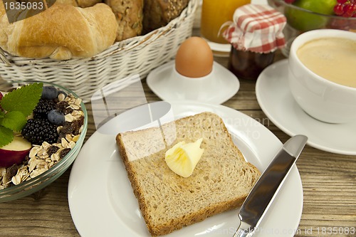 Image of traditional french breakfast on table in morning