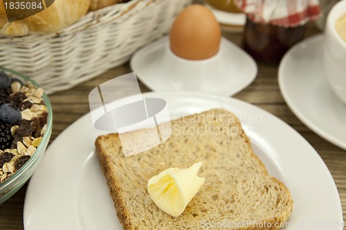 Image of traditional french breakfast on table in morning
