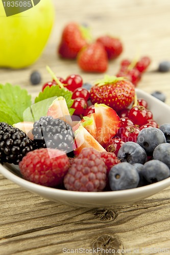 Image of fresh tasty berry collection on table in summer