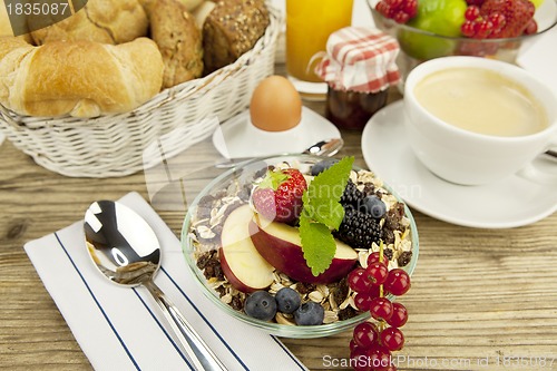 Image of tasty breakfast with flakes and fruits in morning