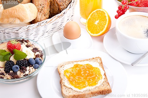 Image of breakfast table with toast and orange marmelade isolated