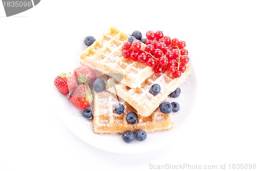 Image of sweet fresh tasty waffles with mixed fruits isolated