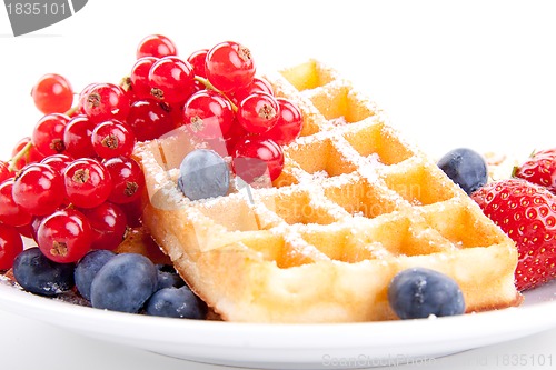 Image of sweet fresh tasty waffles with mixed fruits isolated