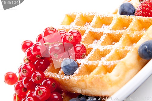 Image of sweet fresh tasty waffles with mixed fruits isolated