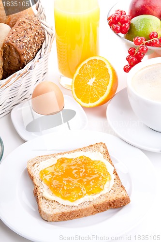 Image of breakfast table with toast and orange marmelade isolated