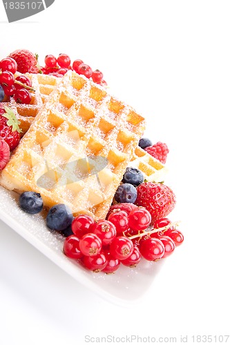 Image of sweet fresh tasty waffles with mixed fruits isolated