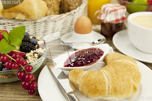 Image of traditional french breakfast on table in morning