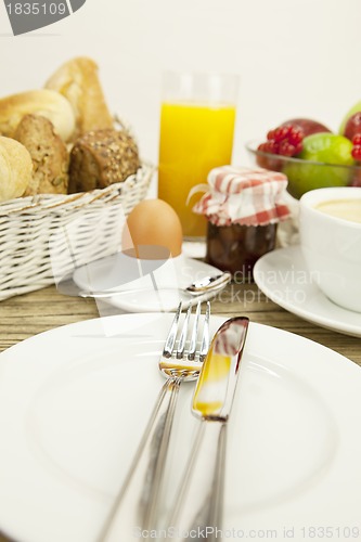 Image of traditional french breakfast on table in morning