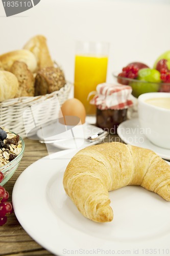 Image of traditional french breakfast on table in morning