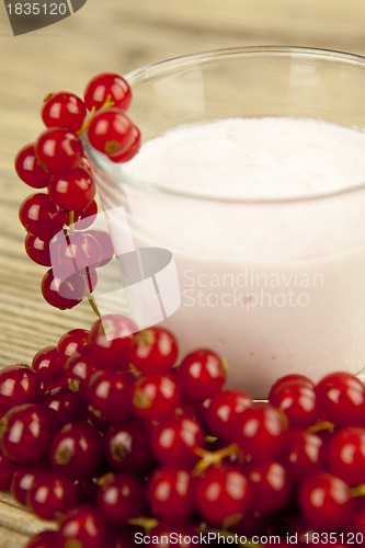 Image of deliscious fresh currant yoghurt shake dessert on table