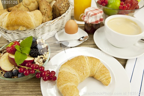 Image of traditional french breakfast on table in morning