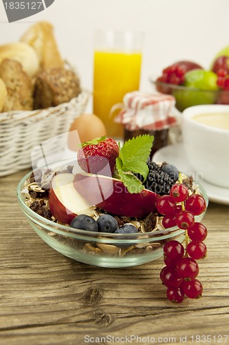 Image of tasty breakfast with flakes and fruits in morning