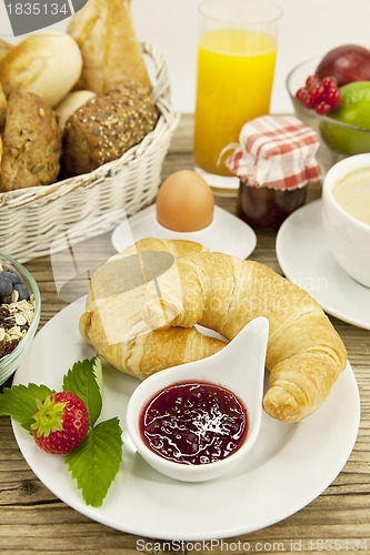 Image of traditional french breakfast on table in morning