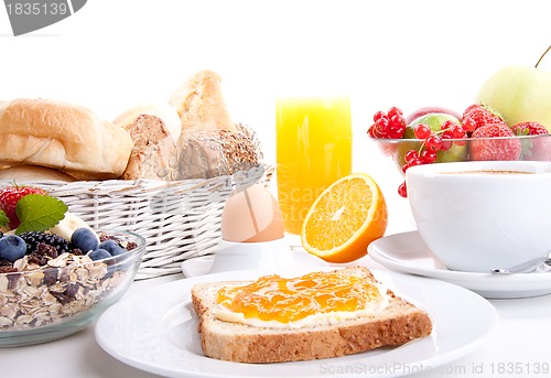 Image of breakfast table with toast and orange marmelade isolated