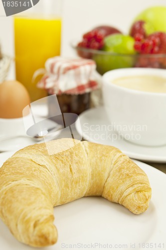 Image of traditional french breakfast on table in morning