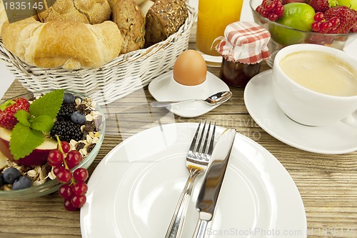 Image of traditional french breakfast on table in morning