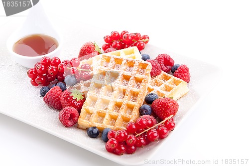 Image of sweet fresh tasty waffles with mixed fruits isolated