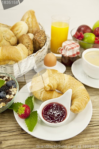 Image of traditional french breakfast on table in morning