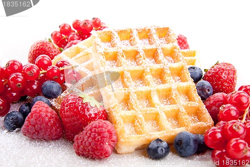 Image of sweet fresh tasty waffles with mixed fruits isolated