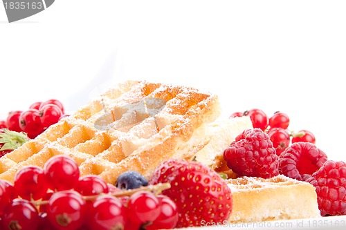 Image of sweet fresh tasty waffles with mixed fruits isolated