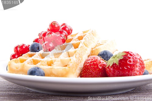 Image of sweet fresh tasty waffles with mixed fruits isolated