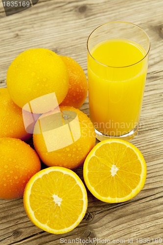 Image of fresh and  healthy tasty orange juice on table