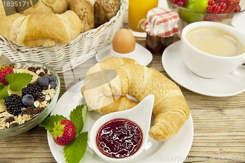 Image of traditional french breakfast on table in morning