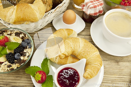 Image of traditional french breakfast on table in morning