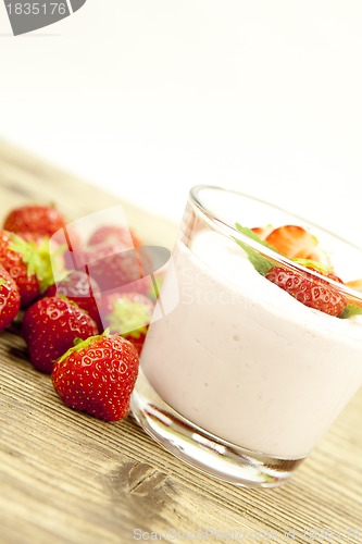 Image of fresh tasty strawberry yoghurt shake dessert on table